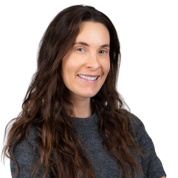 Bright smiling woman with long brown hair, representing quality elder care services.
